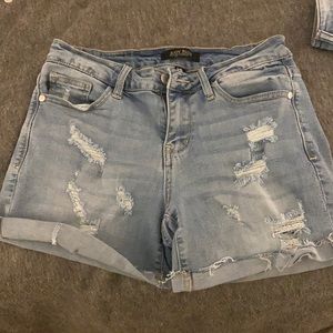Ripped blue jean shorts